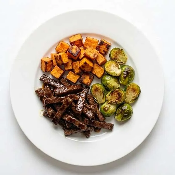 Balsamic Beef Strips with Roasted Sweet Potato Cubes & Sprouts